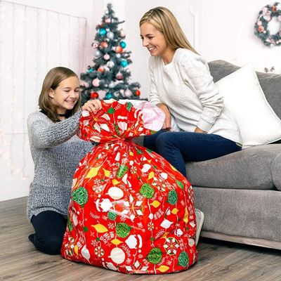 Concevez les sacs en fonction du client en plastique colorés d'enveloppe de cadeau pour l'emballage énorme de présent de Noël