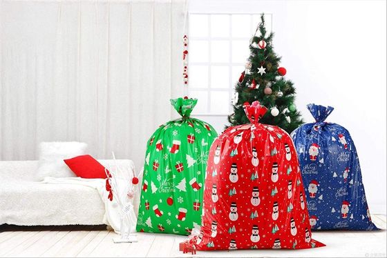 Le cadeau en plastique géant de Noël met en sac le × 36 44 pouces